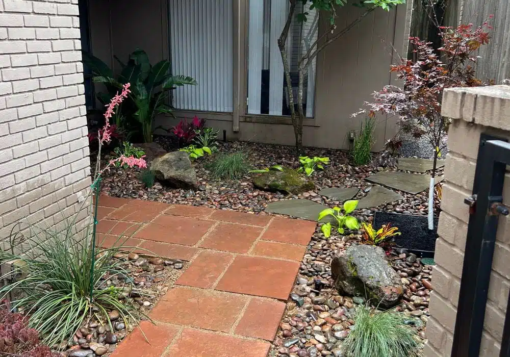 botanical garden surrounding front walkway to home