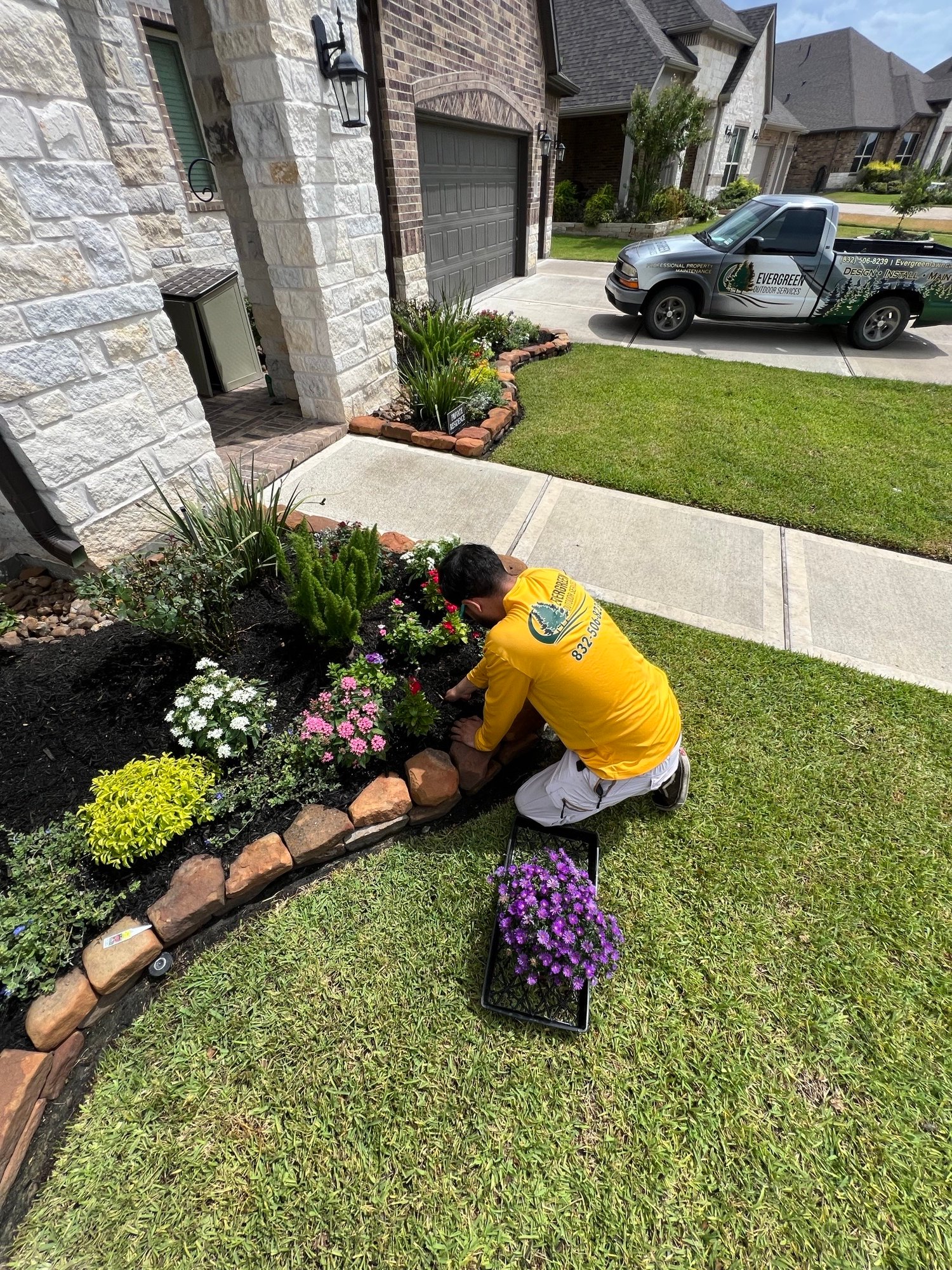 Seasonal color installation in progress, adding vibrant flowers and plants to enhance the landscape