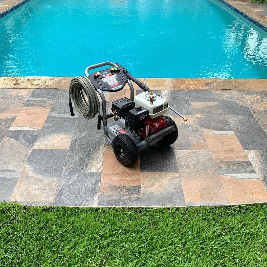 Professional grade pressure washer staged and ready to work.