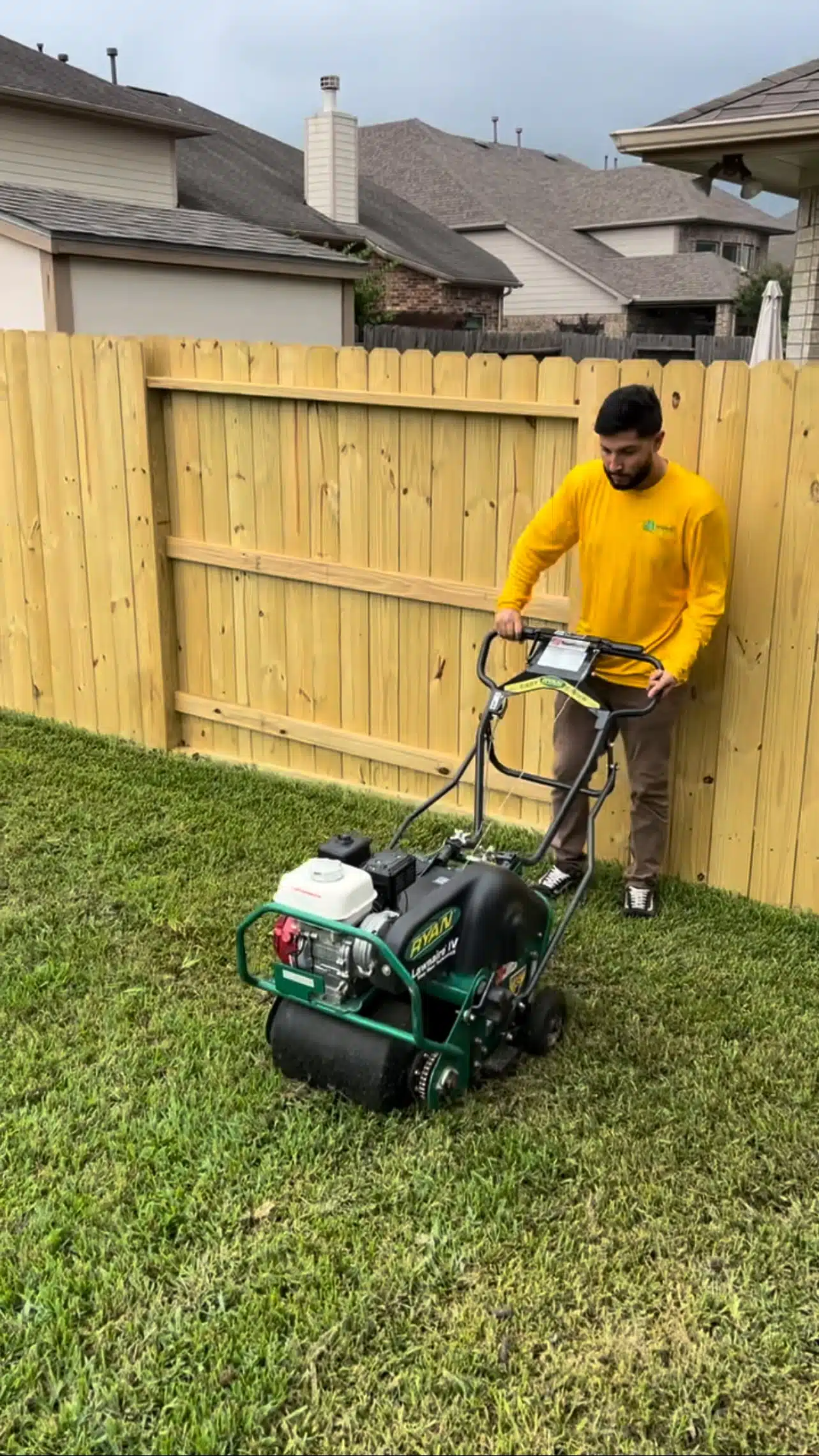 Professional lawn aeration service being performed by Evergreen Outdoor Services