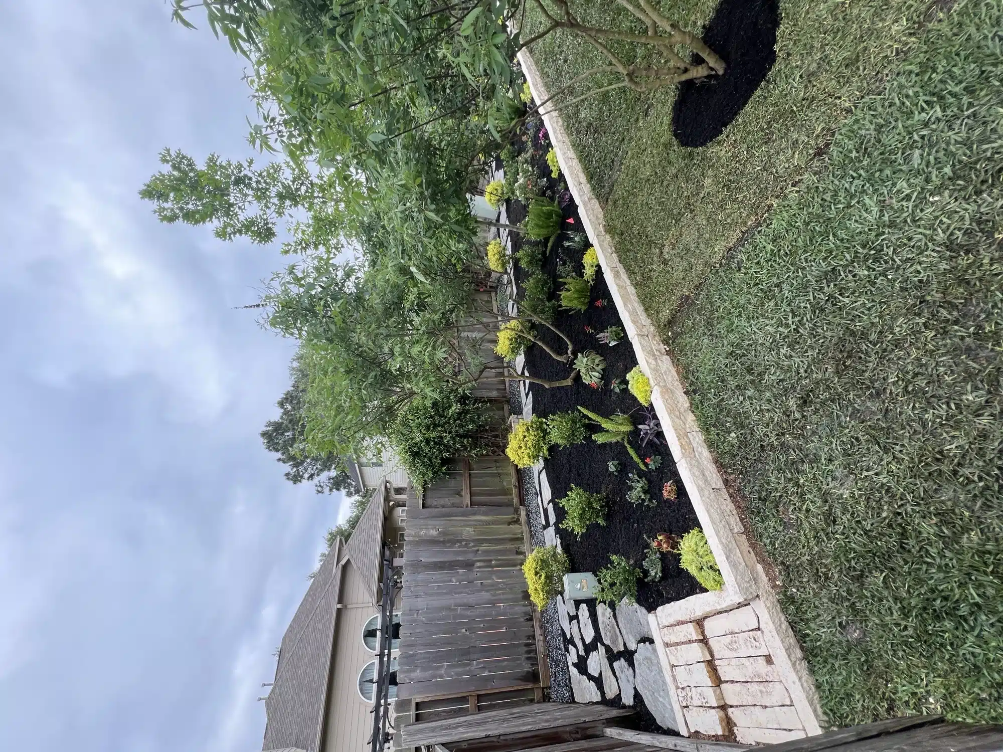 Backyard landscape installation completed by Evergreen Outdoor Services in Houston