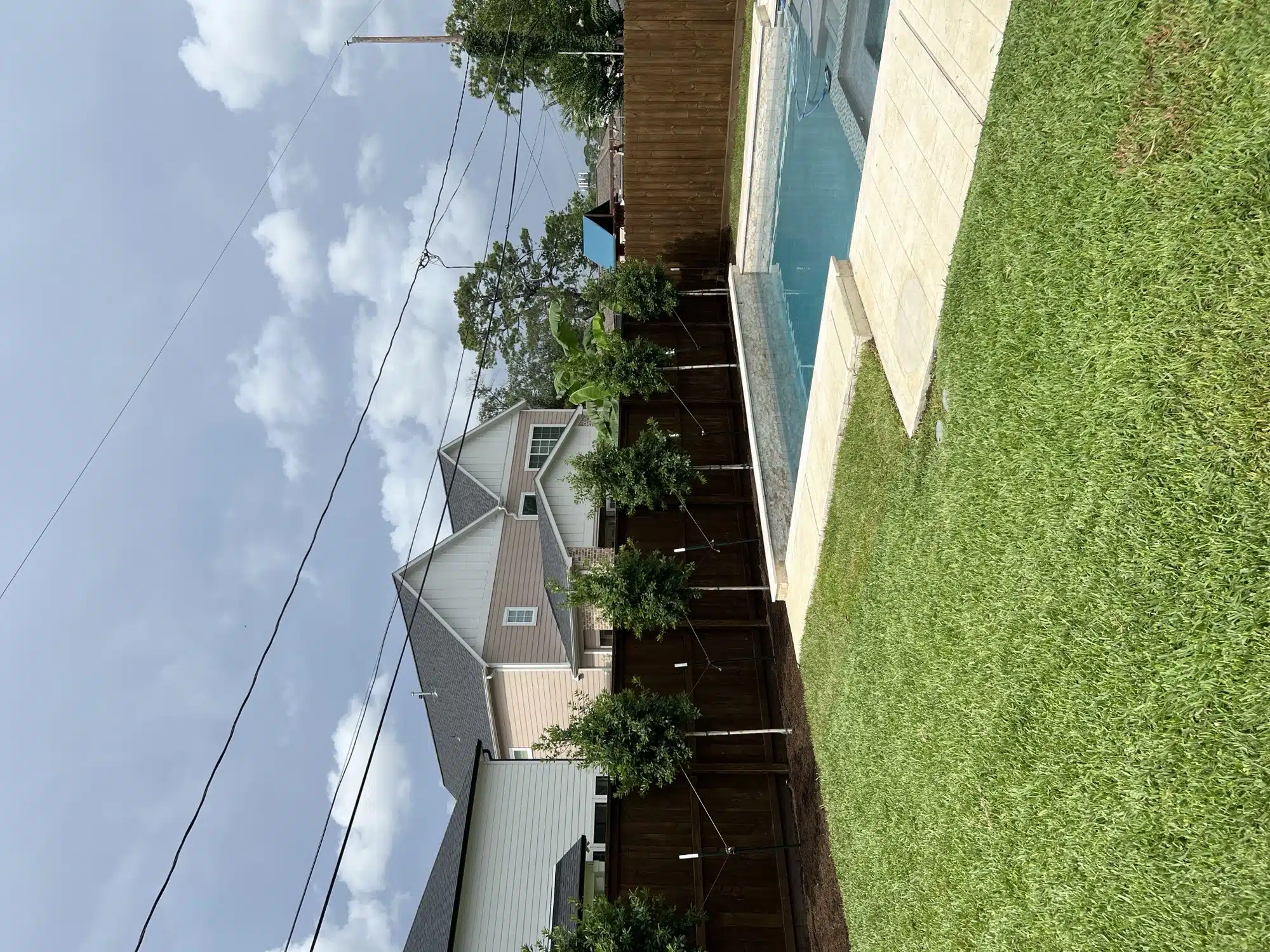 Tree installation completed in a Houston front yard by Evergreen Outdoor Services
