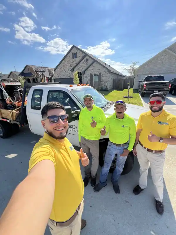 Evergreen Outdoor Services crew and branded truck ready for field service in Houston