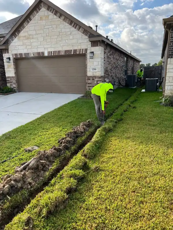 Trenching through Black Gumbo clay in Kingwood, TX — drainage labor intensity