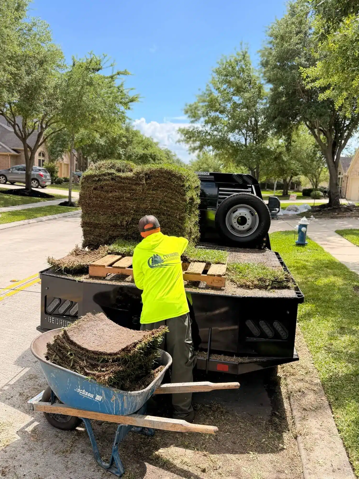 Sod pallets staged for installation at a Houston residential property