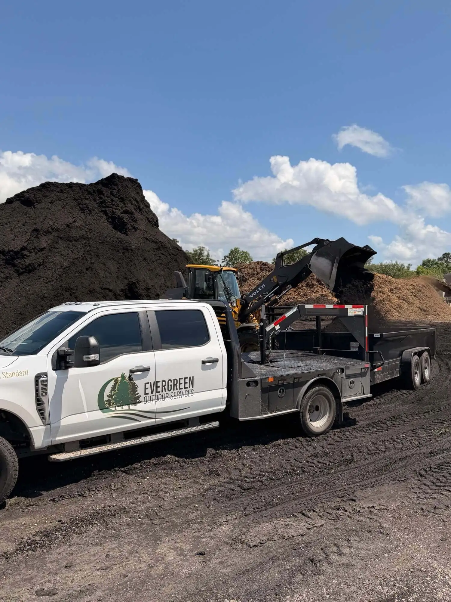 Black mulch loading for Houston landscape bed refresh work