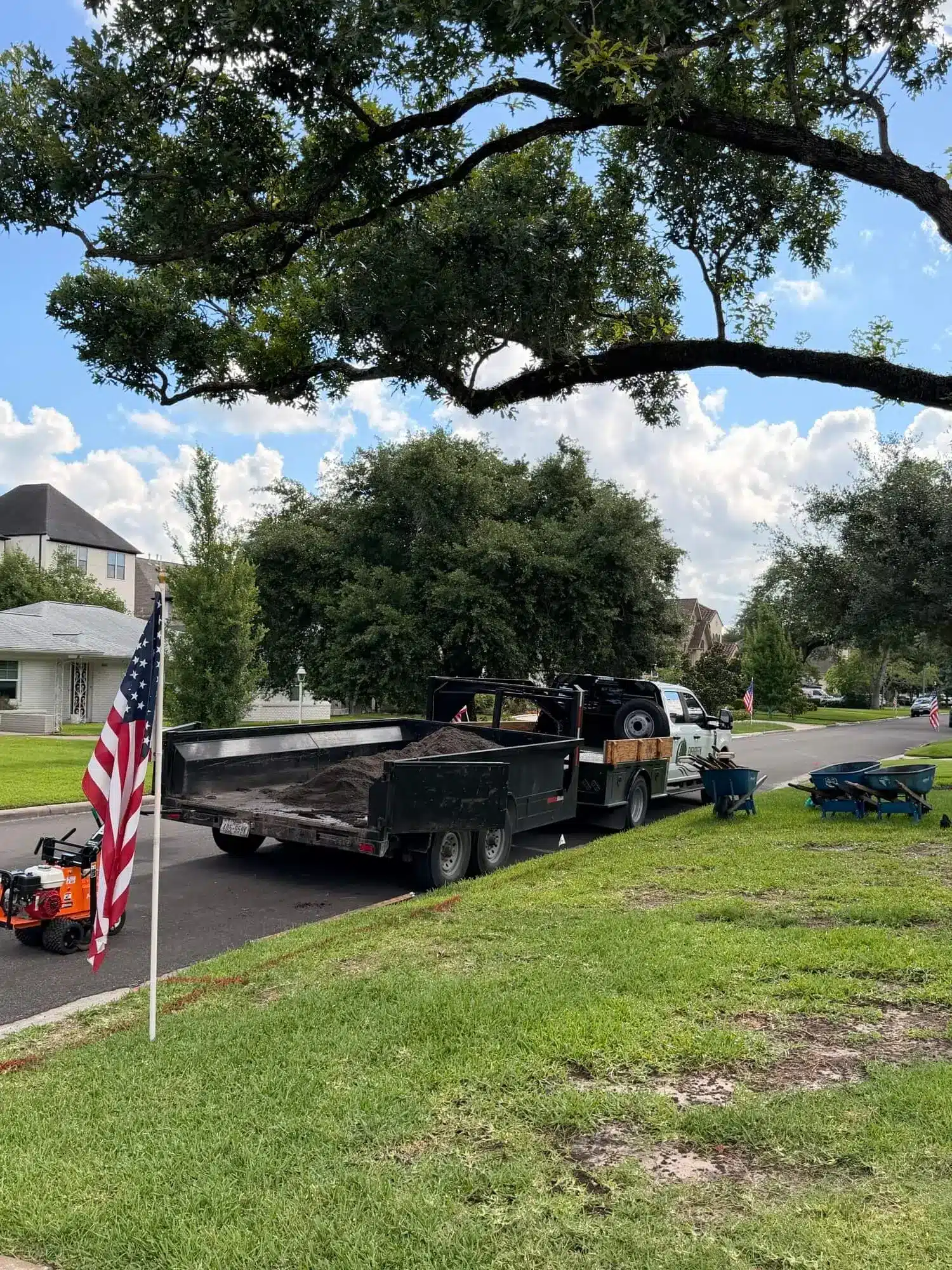 Tired lawn before sod installation for a West Houston residential property